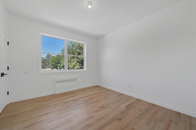 3 Forshee St, Monroe, NY 10950 - unfurnished room with radiator heating unit and light wood-style floors