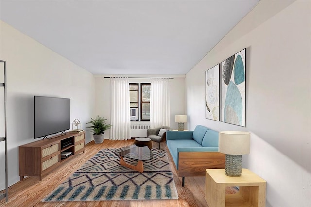 living room featuring light hardwood / wood-style flooring and radiator