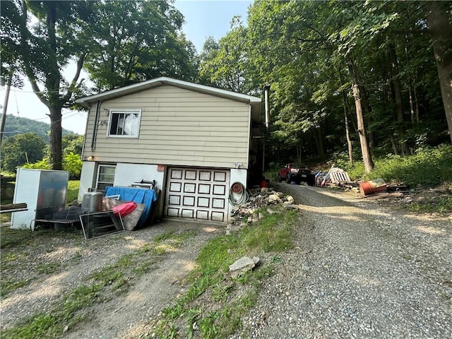 view of side of property with a garage