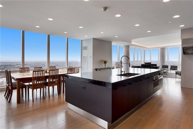 1 Renaissance Sq Unit Ph40A, White Plains, NY 10601 - kitchen with modern cabinets, a spacious island, floor to ceiling windows, open floor plan, and light wood-style floors