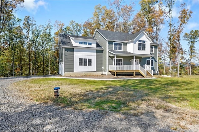 view of front of home featuring a porch and a front yard