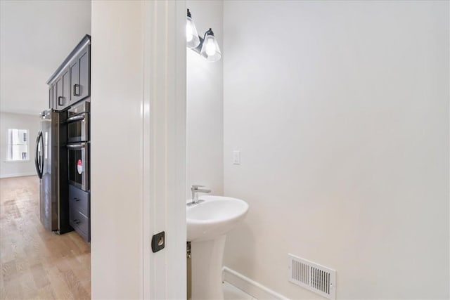 bathroom featuring wood-type flooring