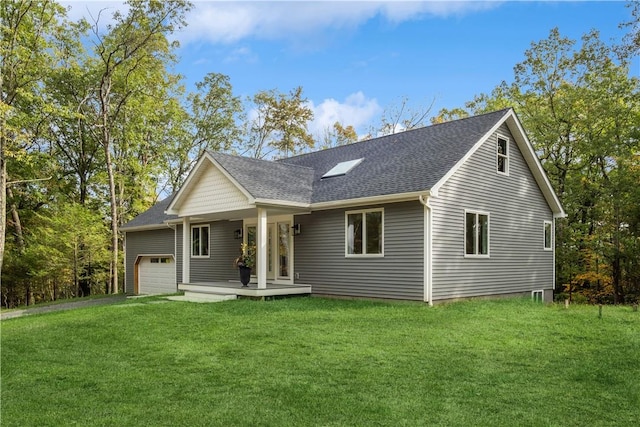 view of front of house with covered porch and a front yard