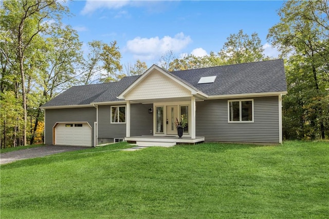 view of front facade featuring a garage, a porch, and a front yard