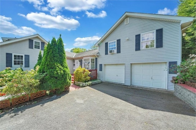 split level home featuring a garage