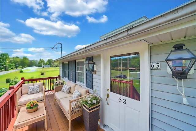 wooden deck with outdoor lounge area