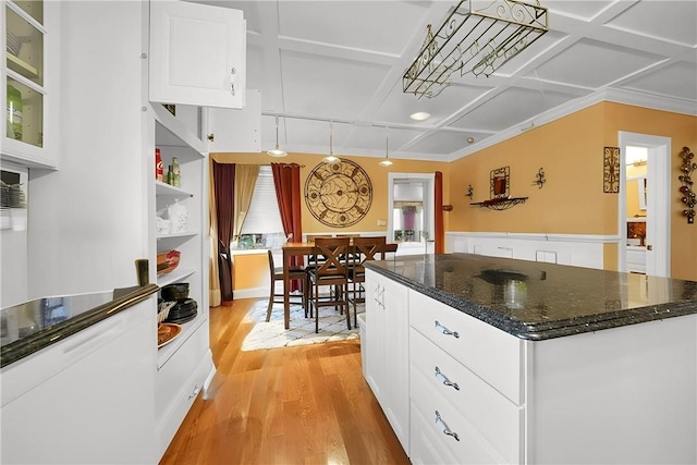 kitchen with white cabinetry, a center island, light hardwood / wood-style floors, and coffered ceiling