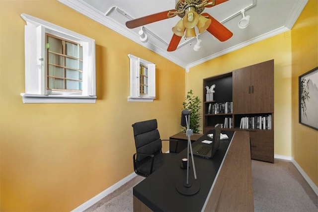 home office featuring ceiling fan, crown molding, rail lighting, and light carpet