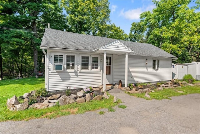 view of front of home with a front lawn