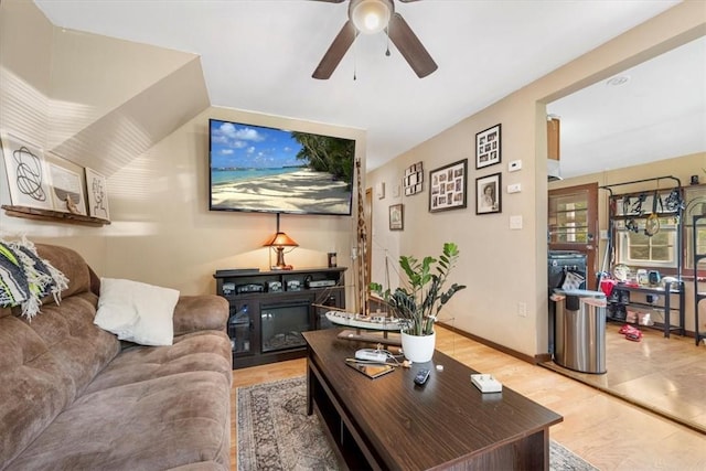 living room with hardwood / wood-style flooring and ceiling fan