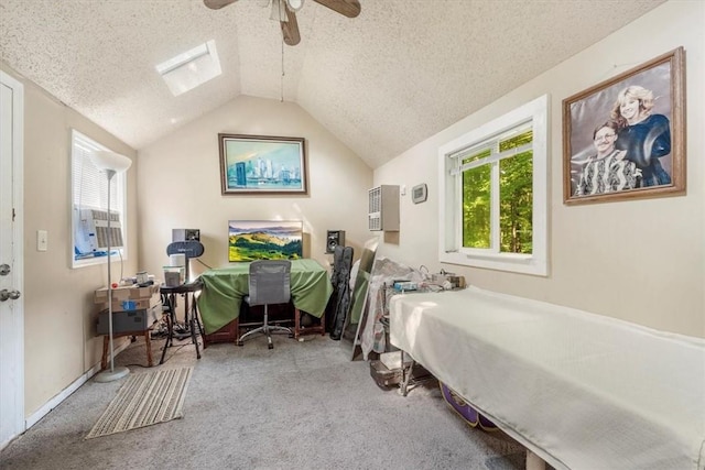 carpeted bedroom with a textured ceiling, ceiling fan, and lofted ceiling