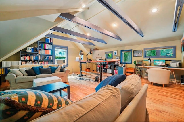 living room featuring lofted ceiling with beams and light hardwood / wood-style flooring