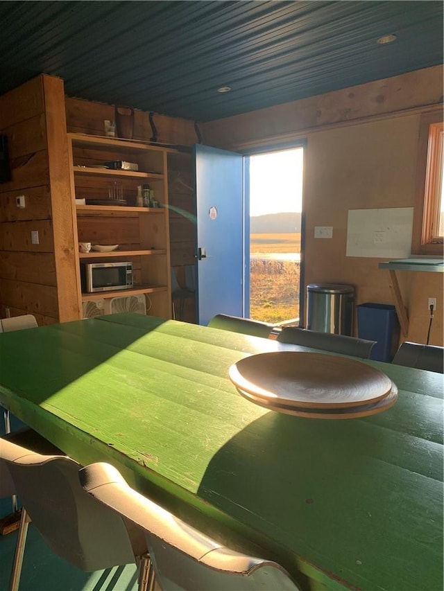 dining area with wood walls