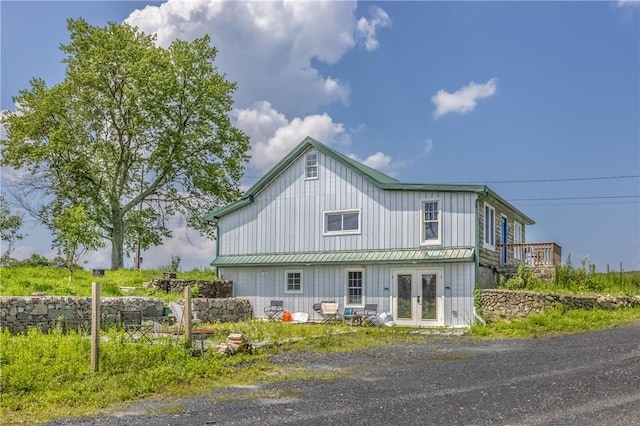 rear view of house featuring french doors