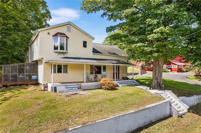 view of front of home featuring a porch and a front lawn