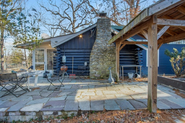 view of patio featuring a sunroom