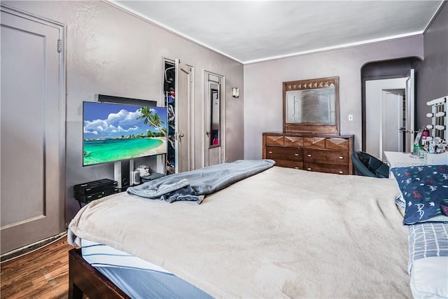 bedroom featuring dark hardwood / wood-style flooring