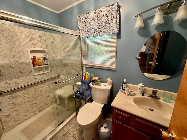 bathroom with toilet, tile patterned flooring, vanity, walk in shower, and crown molding