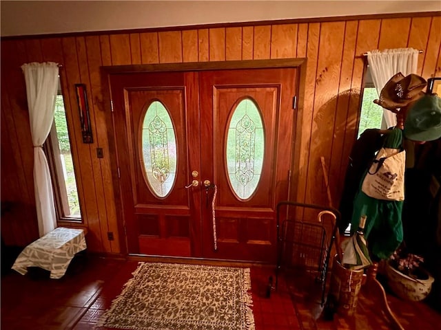 foyer entrance with wood walls