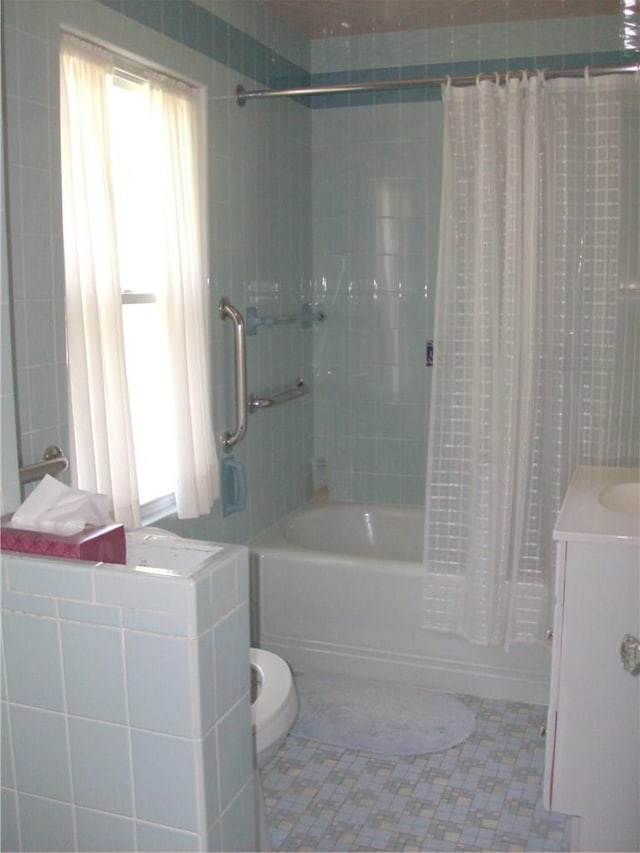 full bathroom featuring shower / tub combo, vanity, toilet, and tile patterned floors