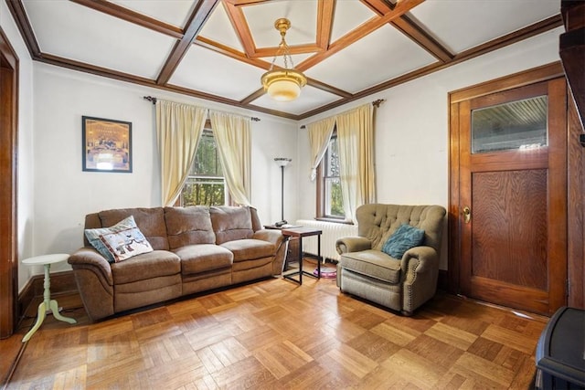 living room with coffered ceiling, radiator heating unit, a wealth of natural light, and light parquet floors