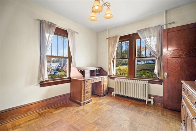 office with radiator heating unit, light parquet floors, and an inviting chandelier