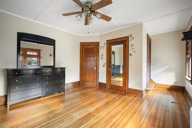 unfurnished bedroom featuring ceiling fan, light hardwood / wood-style flooring, and ornamental molding