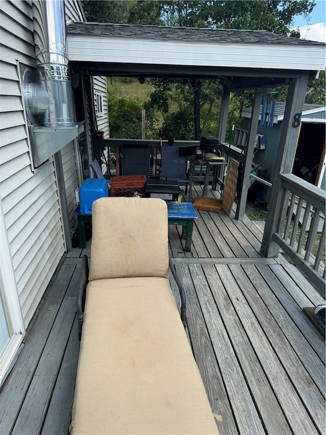 wooden deck featuring grilling area