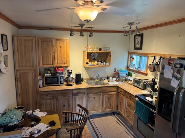 kitchen with ornamental molding, sink, and appliances with stainless steel finishes