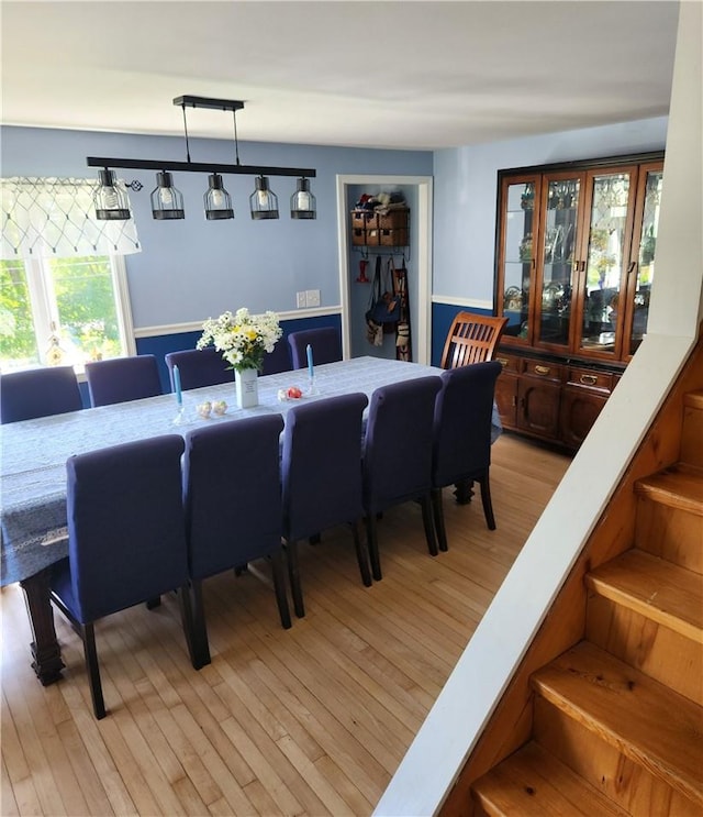 dining space with light wood-type flooring