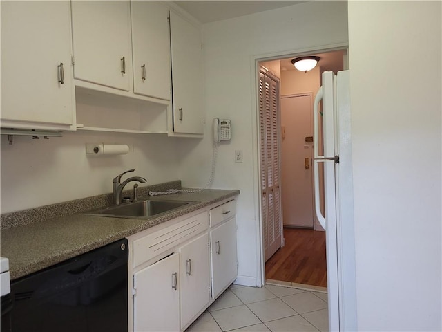 861 Palisade Ave Unit 2D, Yonkers, NY 10703 - kitchen with freestanding refrigerator, black dishwasher, a sink, white cabinets, and open shelves