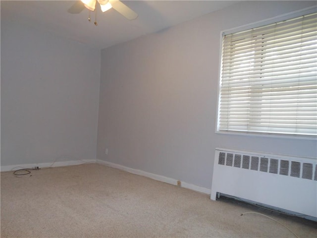861 Palisade Ave Unit 2D, Yonkers, NY 10703 - carpeted empty room featuring radiator heating unit, a ceiling fan, baseboards, and healthy amount of natural light