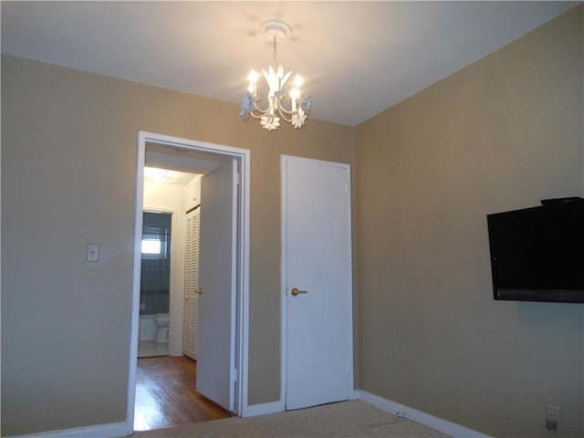 861 Palisade Ave Unit 2D, Yonkers, NY 10703 - unfurnished dining area featuring a chandelier and baseboards