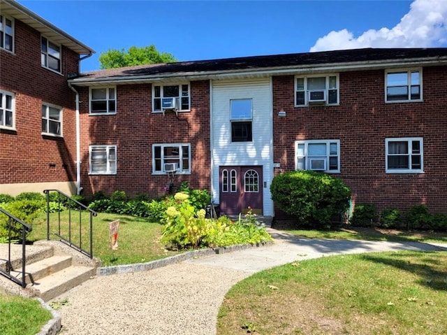 861 Palisade Ave Unit 2D, Yonkers, NY 10703 - view of front of house with a front lawn, brick siding, and cooling unit