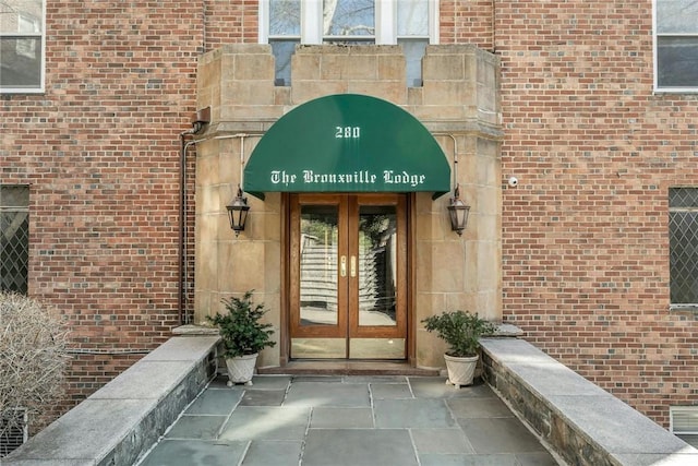 280 Bronxville Rd Unit 9B, Bronxville, NY 10708 - view of exterior entry with french doors and brick siding