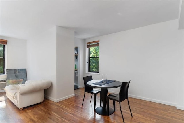 dining area featuring wood-type flooring