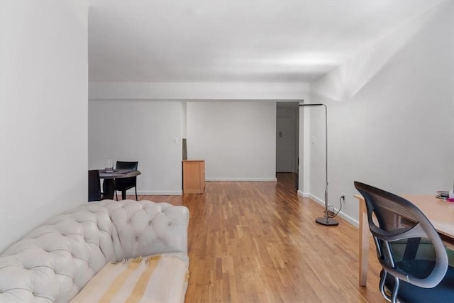 office area with light hardwood / wood-style floors