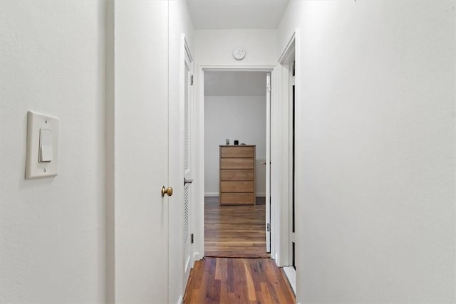 corridor featuring dark hardwood / wood-style flooring