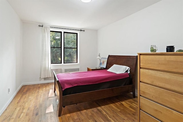 bedroom with hardwood / wood-style floors