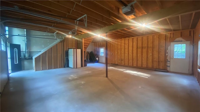 basement with white refrigerator