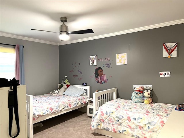 carpeted bedroom with ceiling fan and crown molding