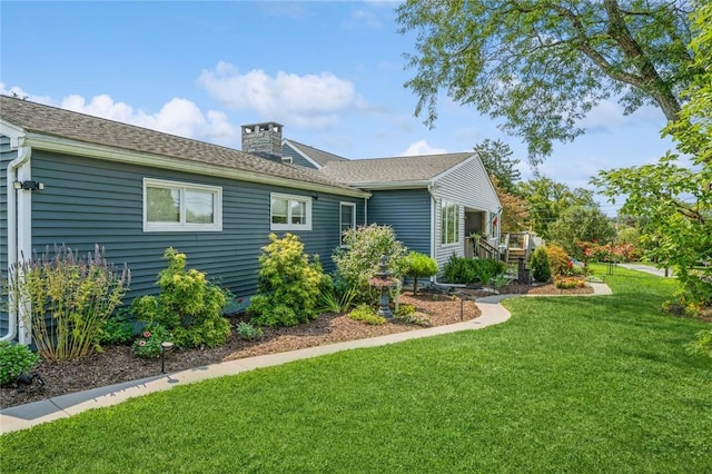 view of property exterior with a lawn