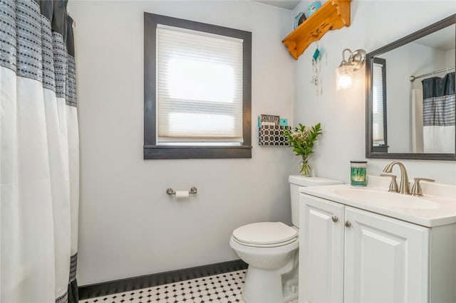 bathroom featuring vanity and toilet