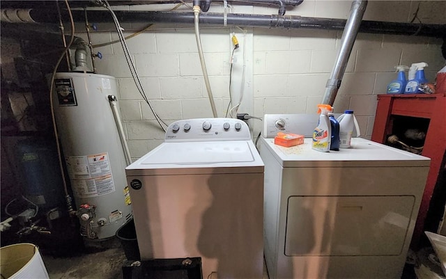 washroom with washer and dryer and gas water heater