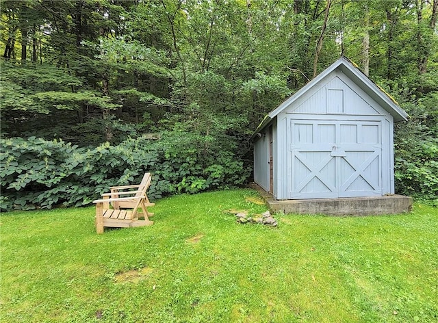 view of outbuilding with a yard