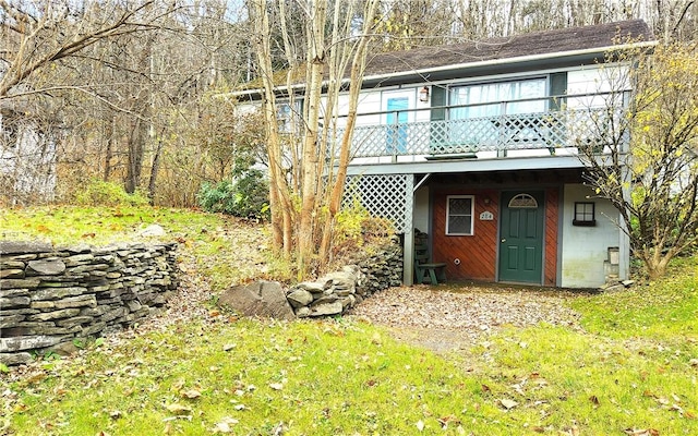 back of house with a wooden deck