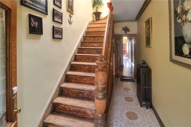 staircase with crown molding