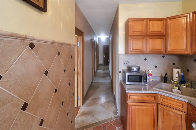 kitchen featuring sink and lofted ceiling