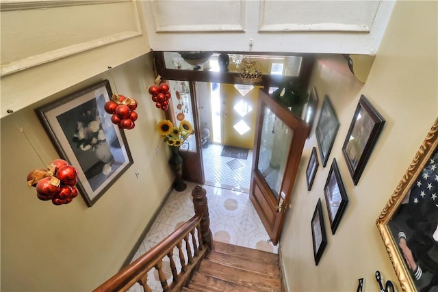 stairs with hardwood / wood-style floors