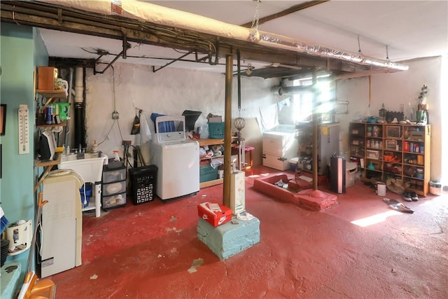 basement featuring washer / dryer and sink